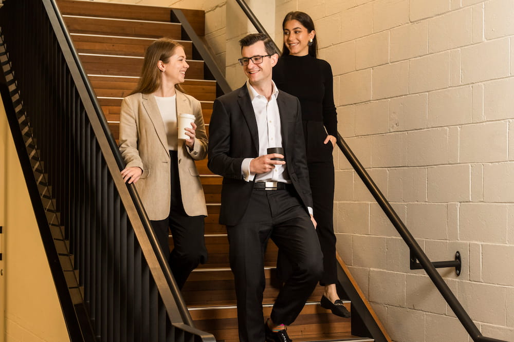 Lawyers with coffee o stairs